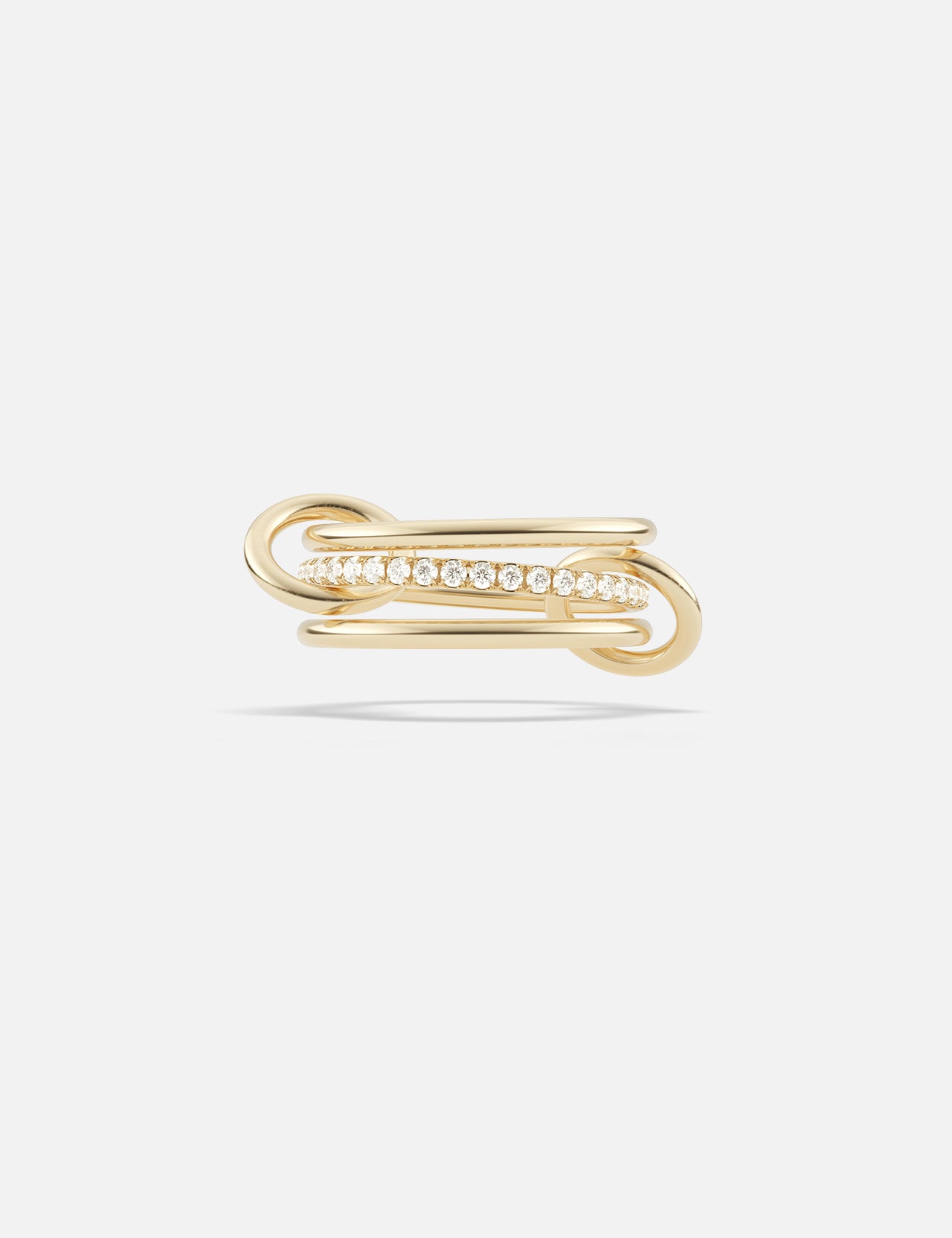 The SPINELLI KILCOLLIN Sonny Pavé Band Ring showcases an elegant looping yellow gold design with a row of sparkling pavé diamonds set at the center, displayed against a plain white background.