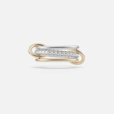 The SPINELLI KILCOLLIN Tigris Pavé Band Ring features intertwined yellow and white gold bands, with the white gold band pavé-set with round diamonds, showcased against a plain white background.