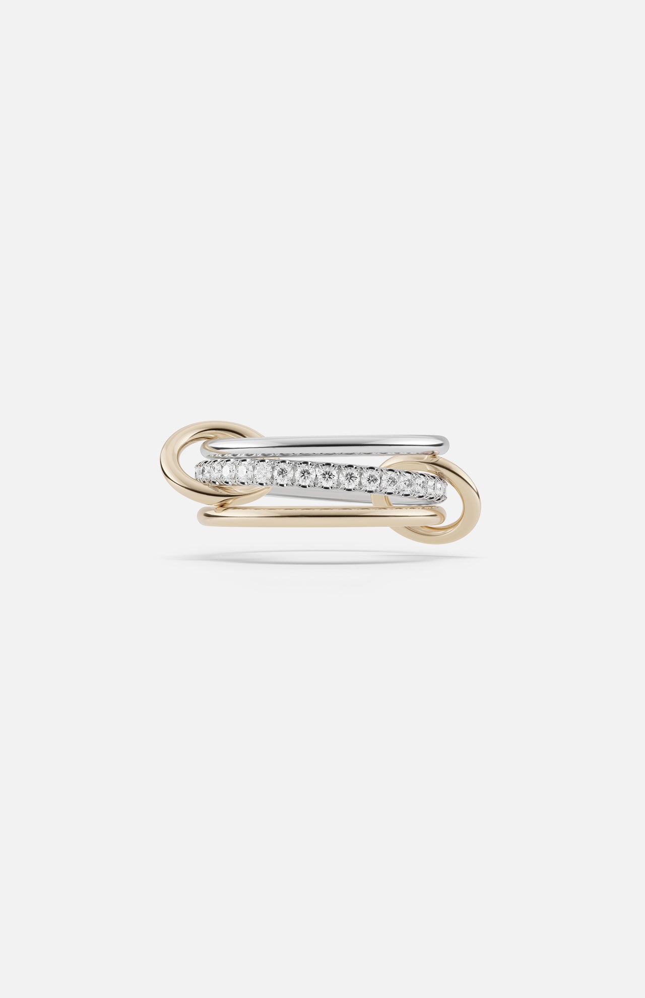 The SPINELLI KILCOLLIN Tigris Pavé Band Ring features intertwined yellow and white gold bands, with the white gold band pavé-set with round diamonds, showcased against a plain white background.