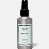 A silver bottle of FLAMINGO ESTATE Roma Heirloom Tomato Room Spray, adorned with a mint green label and black spray nozzle, set against a simple light background—this home fragrance evokes the fresh scent of summer-ripe tomatoes at their peak.