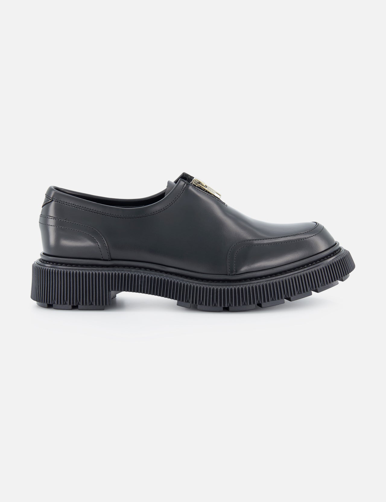 The ADIEU Type 193(x8) is a black slip-on loafer with a chunky, ridged sole and gold-tone detail on the upper, featured in a side profile view against a plain white background.