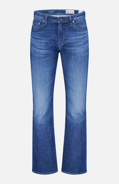 The AG Clint Bootcut Stretch Jeans feature a classic dark blue wash, five-pocket design, subtle thigh fading, and a comfortable bootcut fit, shown against a plain white background.