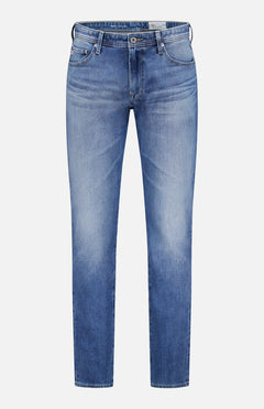 The AG Everett All-direction Stretch Jeans are slim fit blue jeans made from stretch denim, featuring a classic five-pocket design, button and zip closure, and light fading on the thighs and knees. Shown against a plain white background.