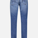 Back view of AG Everett All-direction Stretch Jeans in blue stretch denim, showing two rear pockets, subtle stitching, and a beige waistband patch. Slim fit cut is displayed against a plain light background.