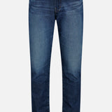 The AG Everett Jean in 5 Years features classic five-pocket styling and a straight leg cut in dark blue denim, displayed against a white background.