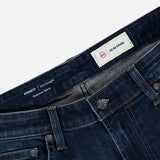 Close-up of AG Everett Jean in 5 Years, showing the dark blue slim fit denim, waistband, buttons, belt loops, pockets, and two labels.