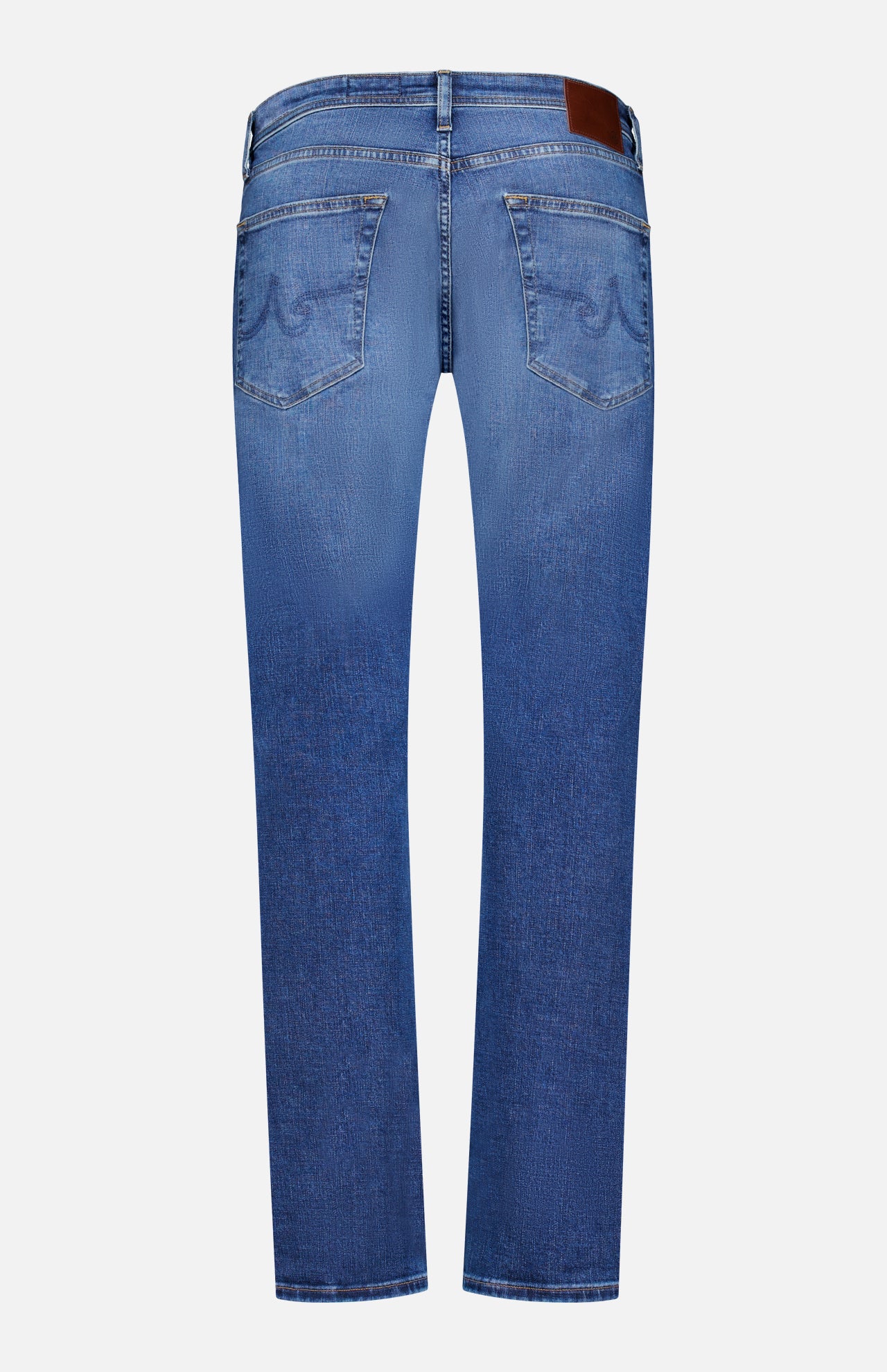 Back view of AG Cloud Soft Everett Jeans in Grove, featuring slim fit, two back pockets, brown leather patch on the waistband, and tan stitching, shown against a plain white background.