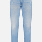 The AG Everett Jeans in 22 Years feature a light blue wash, straight-leg cut, subtle thigh and knee fading, vintage five-pocket design, and button fly closure, shown against a plain white background.