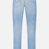 Back view of AG's Everett Jeans in 22 Years: light blue vintage-inspired wash, pockets and stitching detail, straight leg cut, finished with a brown leather patch on the waistband.
