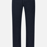 AG’s Everett Slim Corduroy Pant, shown against a plain white background, presents a timeless option in place of traditional dark blue straight-leg jeans with five pockets, button closure, and belt loops.