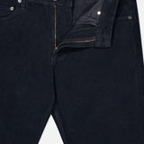 The AG Everett Slim Corduroy Pant, shown in black with a partially open zipper and button fly, features a straight leg silhouette and is displayed on a white background.