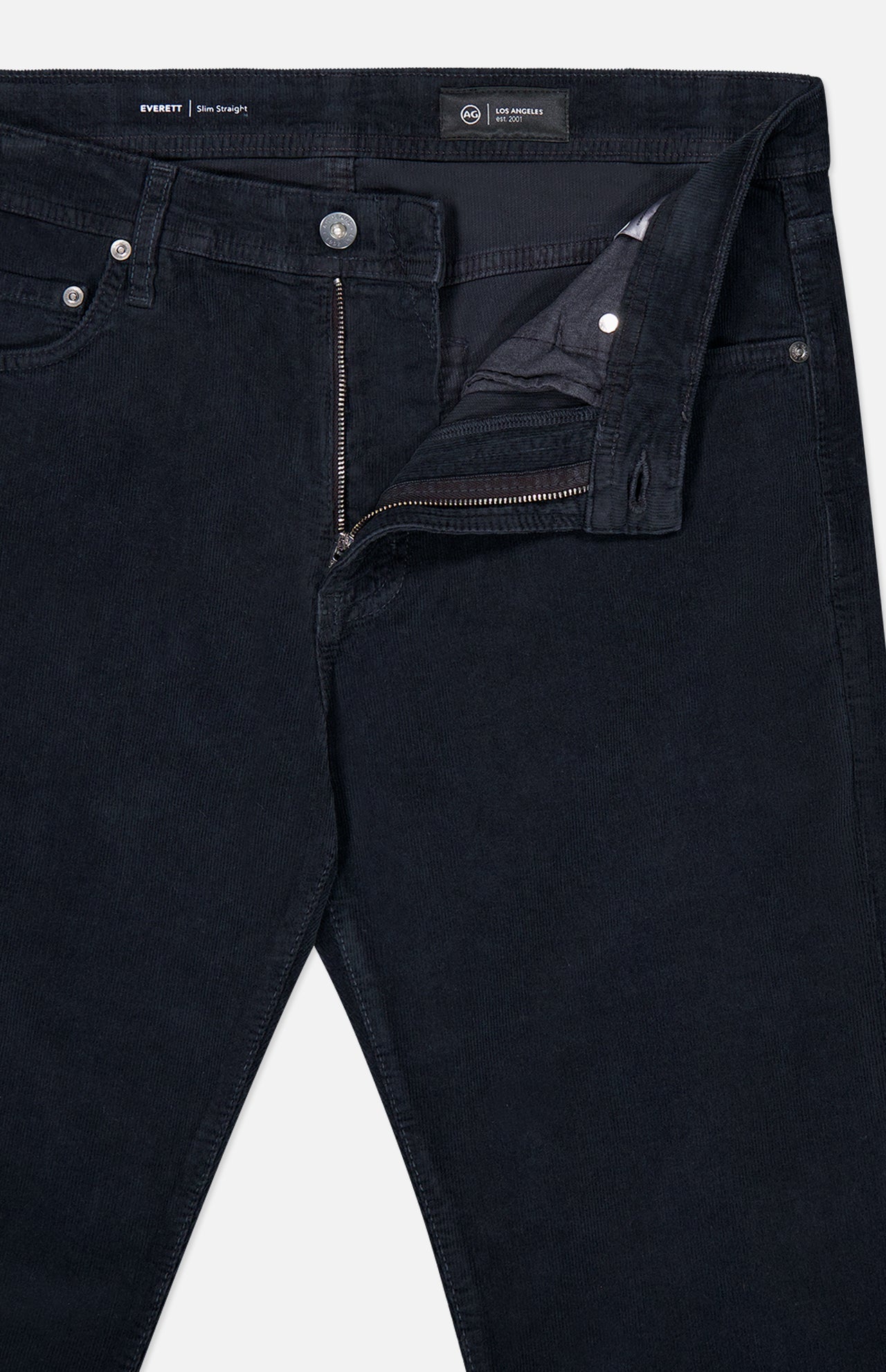 The AG Everett Slim Corduroy Pant, shown in black with a partially open zipper and button fly, features a straight leg silhouette and is displayed on a white background.