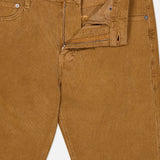 A pair of Everett Corduroy Pant in Bronze by AG, featuring a slim fit and a subtle bronze corduroy fabric, shown with the fly unzipped and button undone to reveal the waistband and part of the front pockets.