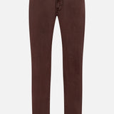 The Everett Pants in Sulfur by AG are slim-fit, brown linen-blend jeans with front and back pockets, zip fly, and belt loops, shown against a white background.