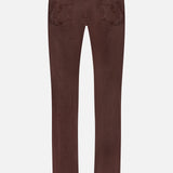 Back view of AG Everett Pants in Sulfur, slim fit denim with two back pockets featuring decorative stitching and a black waistband patch, shown against a plain light background.
