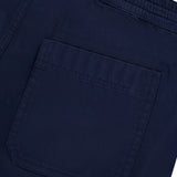 Close-up of the back pocket on AG's Oliver Drawstring Shorts in navy, showcasing the elastic waist, intricate stitching, and textured fabric.