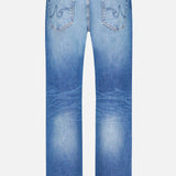 Back view of the AG Protege Jean in 14 Years, featuring light blue straight leg denim with two back pockets, faded vintage detailing, contrast stitching, and a brown leather patch on the waistband.