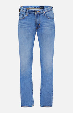 The AG Protege Straight Leg Jeans in Promise are comfortable, stretch light blue denim with five pockets and a button closure, featuring a classic straight leg silhouette. Shown against a white background.