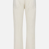 Back view of AG Protege Pants in Pumice, featuring creamy denim, straight-leg cut, two back pockets, belt loops, and a rectangular patch on the waistband.