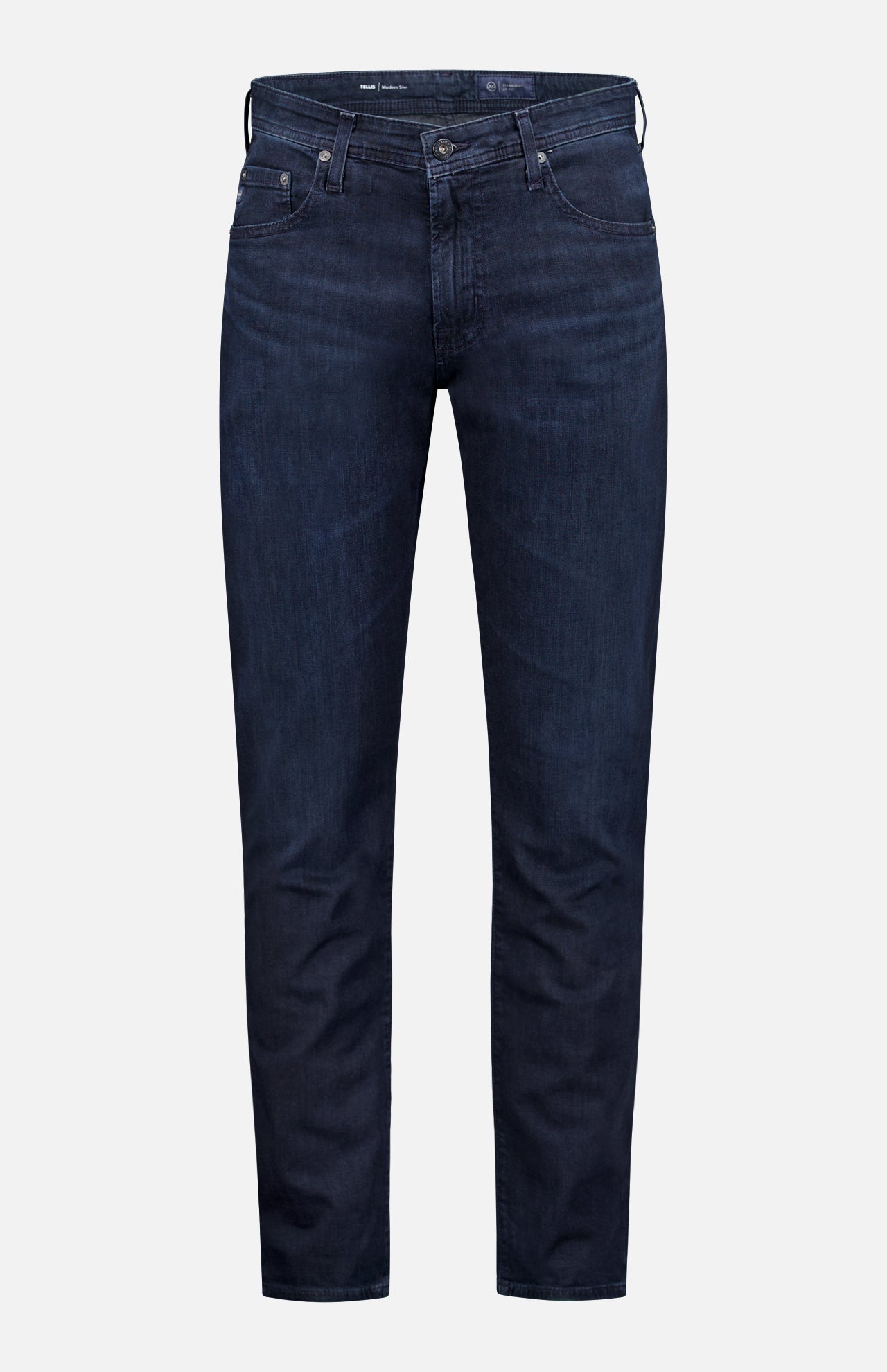 The AG Tellis Slim Jeans in Tamarack are dark blue men's jeans featuring a slim fit, five pockets, and belt loops, shown against a plain light gray background.