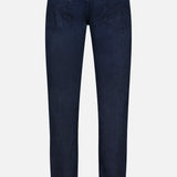 The AG Tellis Slim Jeans in Tamarack are shown from the back, featuring two back pockets, belt loops, and a black patch on the waistband against a plain white background.