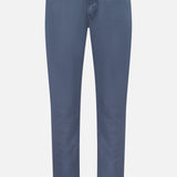 AG Tellis Sueded Sateen Pants in Blue Grain feature a slim fit, five pockets, belt loops, and a light blue-gray microsueded finish, shown against a plain white background.