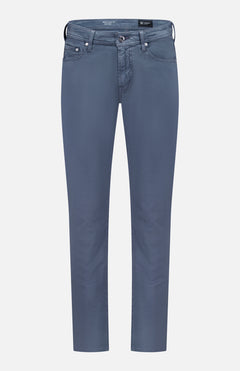 AG Tellis Sueded Sateen Pants in Blue Grain feature a slim fit, five pockets, belt loops, and a light blue-gray microsueded finish, shown against a plain white background.