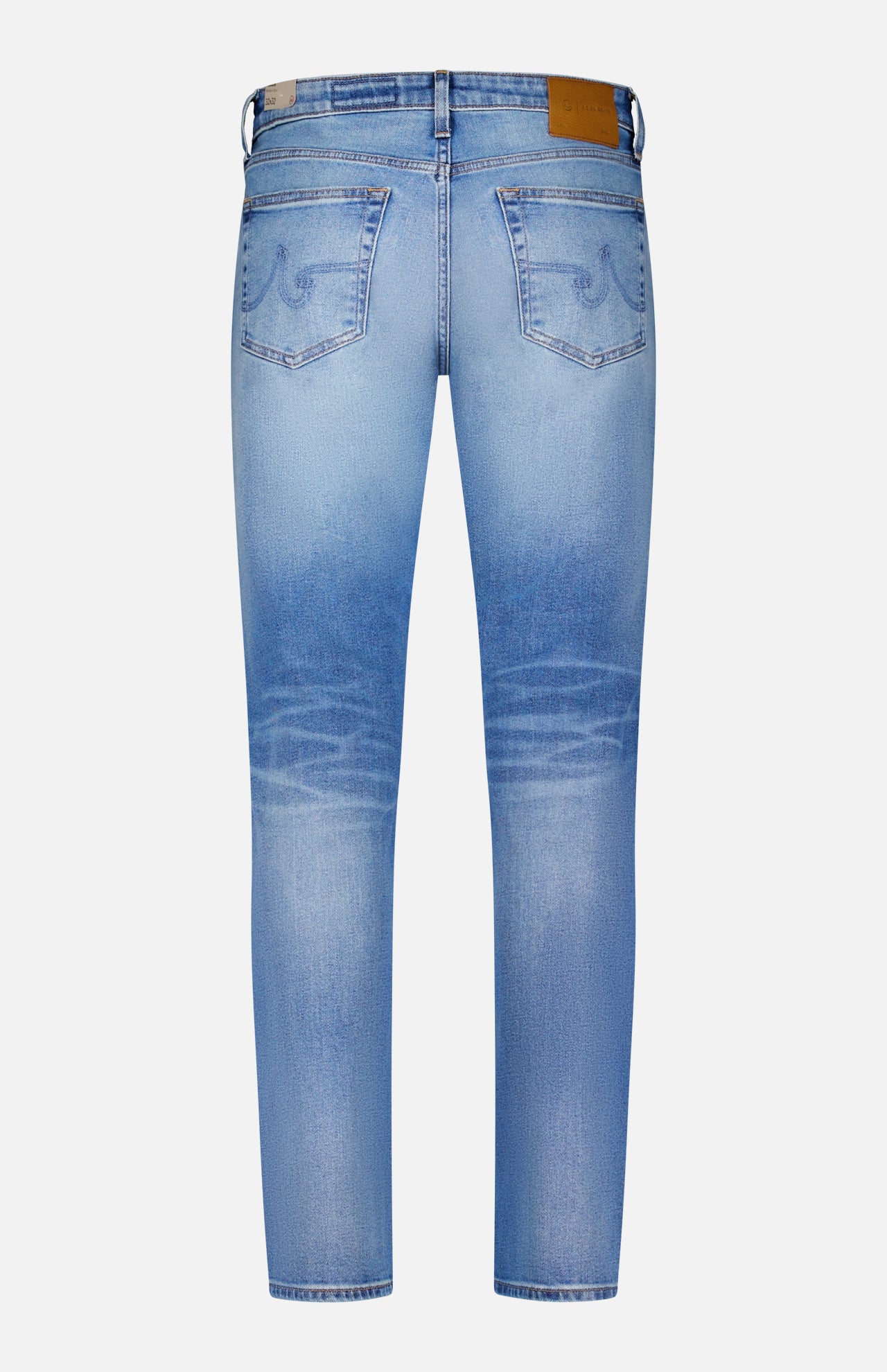 The AG Tellis Aged Jeans are slim-fit, light blue denim with vintage-inspired fading at the thighs and knees, subtle back pocket stitching, a leather waistband patch, and classic style shown from the back.