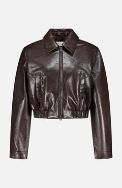 The Essie Recycled Cropped Jacket by AGOLDE features a dark brown leather finish, front zipper, collar, long sleeves, gathered hem, and chest seam details. Displayed on a plain background.