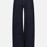 AGOLDE’s Harper Jean in Reissue features a wide-leg silhouette in dark indigo denim, designed with a high waist, front button and zipper closure, and classic five-pocket styling. Displayed on a plain white background, these straight leg jeans deliver timeless style and effortless versatility for any wardrobe.