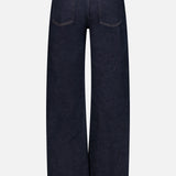 The Harper Jean in Reissue by AGOLDE is crafted from a rich dark indigo denim and designed with a high-waisted, wide-leg silhouette. Shown from the back, these jeans feature two oversized rear pockets, prominent stitching, and classic belt loops. Laid flat against a plain light background, the pair highlights its structured yet relaxed fit.
