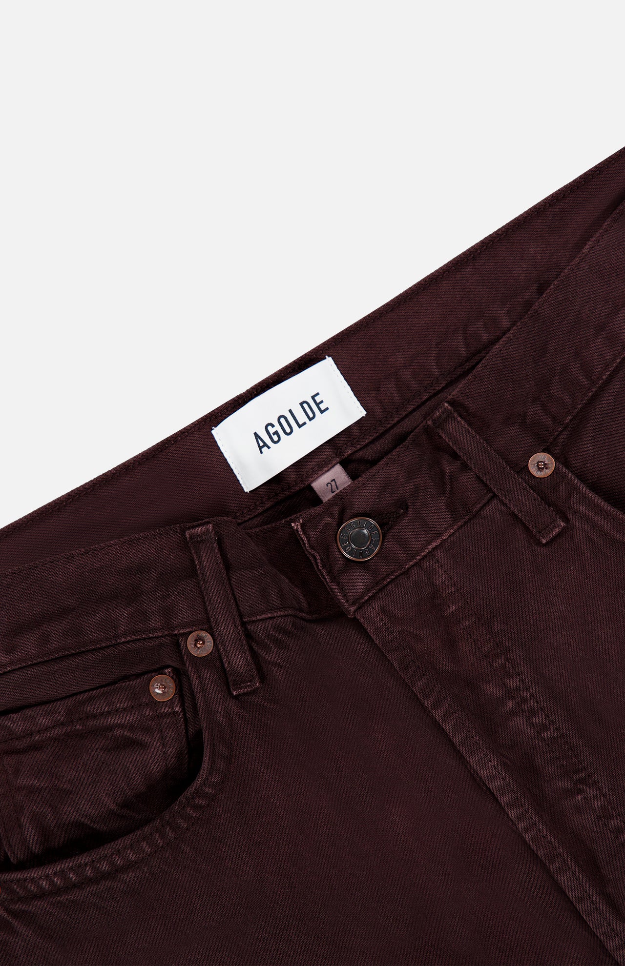 Close-up of the waistband and top of a pair of AGOLDE Ren Jean in Sloe Berry high-rise jeans, showing the brand label, button, zipper, belt loops, and pockets on a white background.