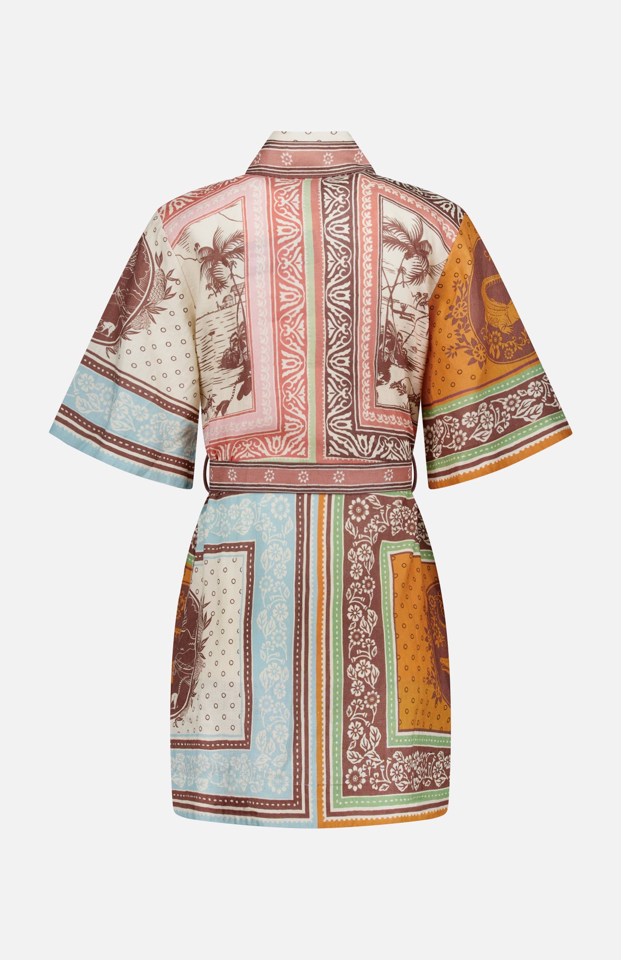 The Alberta Mini Linen Dress by ALEMAIS is a short-sleeved, belted bohemian mini with a patchwork of tropical and geometric prints in brown, orange, green, and blue. Shown from the back against a white background.