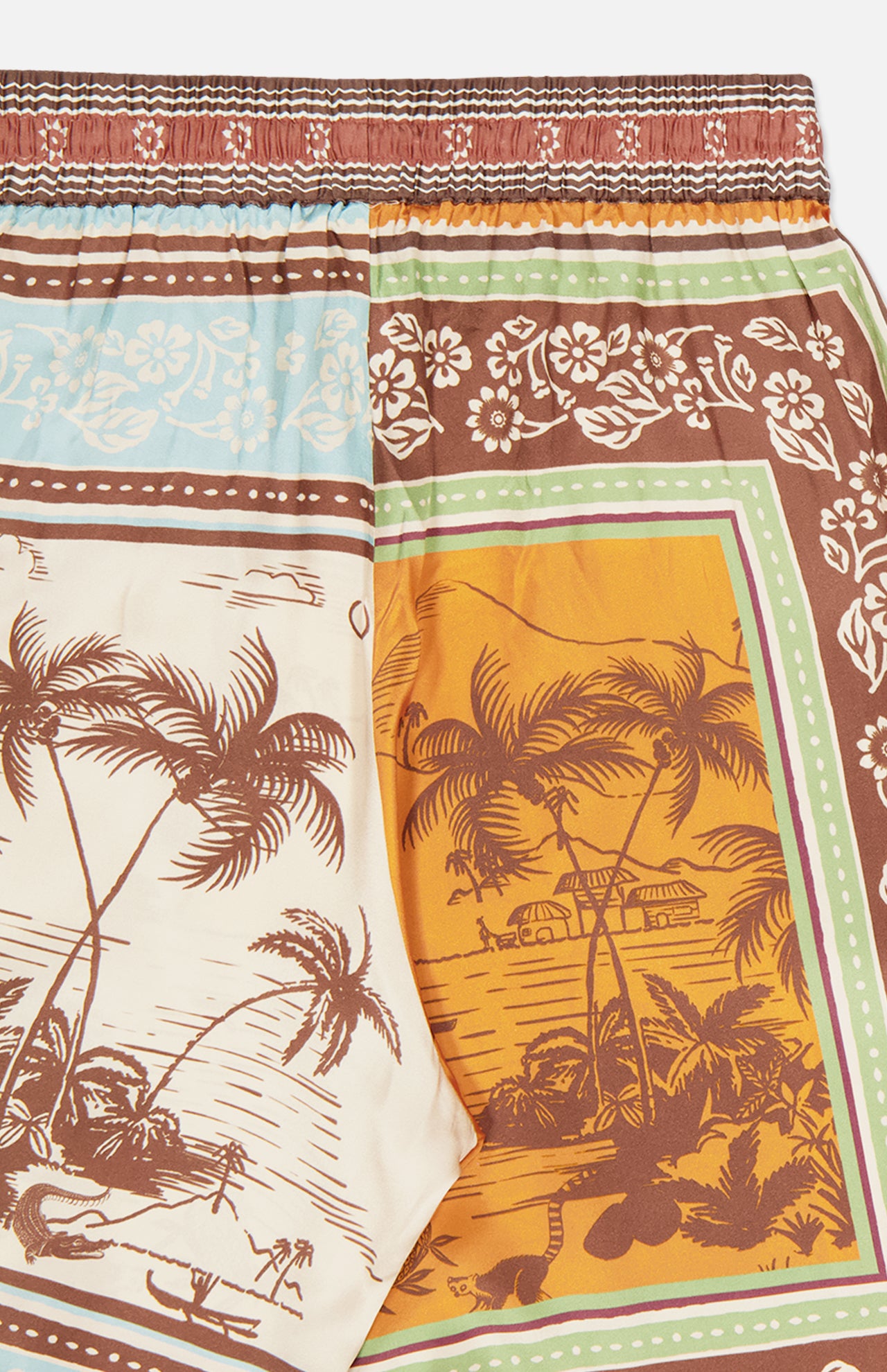 The ALEMAIS Alberta Silk Pull-on Pant features colorful, tropical island-inspired patterns with floral designs in earthy tones and vibrant blues, creating a bohemian vibe on these relaxed-fit pants.