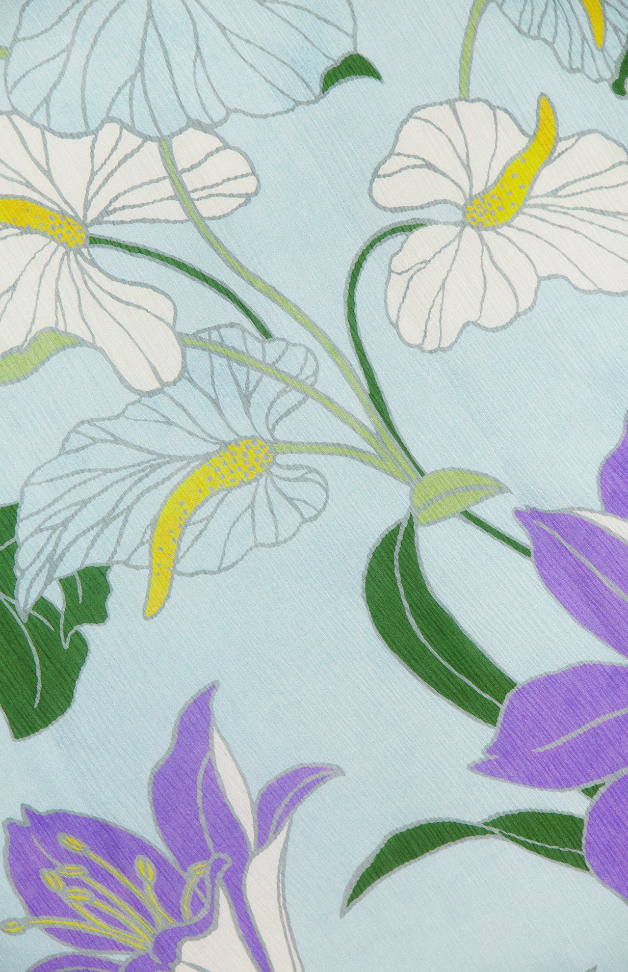 The Alfie Sleeveless Midi Dress by ALEMAIS features a floral print with white and purple flowers with yellow centers, green leaves, and stems on a light blue background.