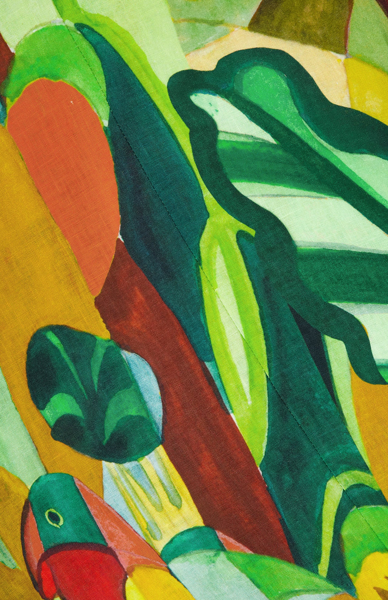 The ALEMAIS Mokshini Artist Collab Sundress features bold, overlapping green, red, yellow, and blue shapes with curved and angled lines, blending organic and geometric elements for a vibrant, dynamic look.