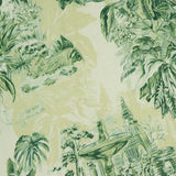 A vibrant green and yellow illustration of tropical plants, a fountain, and a monkey inspires the Sara Mini Twist Sundress by ALEMAIS—an ideal choice for those seeking lush, exotic style with bold foliage prints.