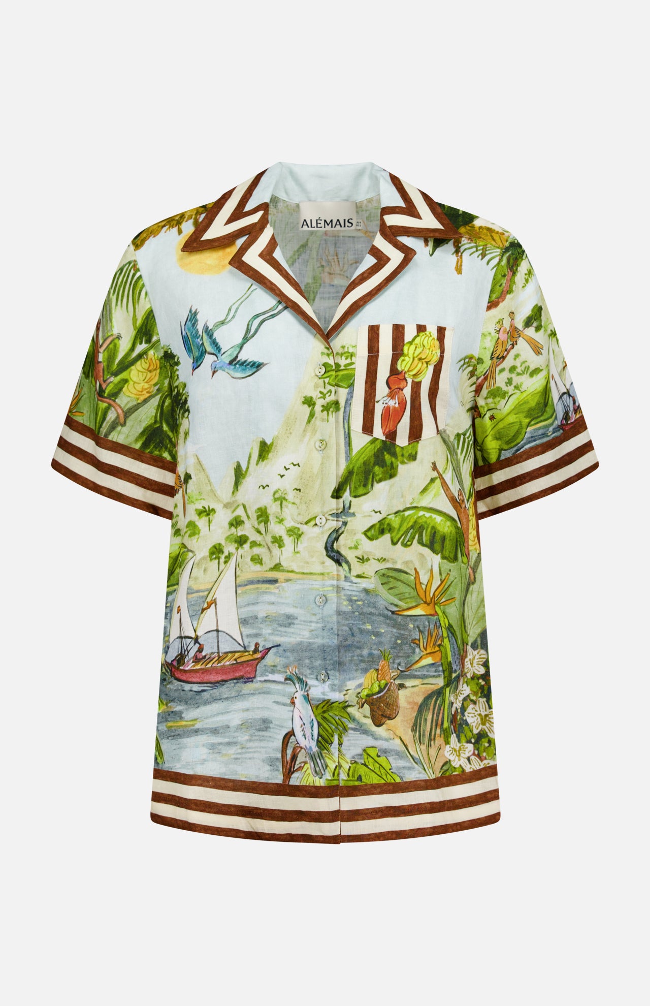 The Toucan Tango Linen Shirt by ALEMAIS is a short-sleeved tropical print featuring birds, boats, palm trees, mountains, brown and white stripes, and a chest pocket. Created in collaboration with artists for a unique look.