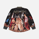 The ALICE + OLIVIA Cora Voluminous Long Sleeve Blouse features blouson sleeves and a detailed classical art print with figures in flowing robes on a dark background, plus ornate patterns on the collar and cuffs.