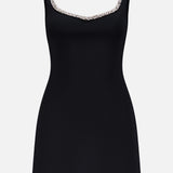 The Eve Embellished Trim Sweetheart Mini Dress by ALICE + OLIVIA is a sleeveless black mini dress with a fitted silhouette and crystal embellished trim, shown against a plain white background.