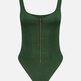 The Eve Zip Front Bodysuit Top by ALICE + OLIVIA is a dark green one-piece with a sculpting fit, thick shoulder straps, and a vertical gold front zipper.