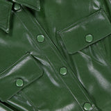 Close-up of the Jamie Vegan Leather Collared Mini Dress by ALICE + OLIVIA, featuring snap buttons, flap chest pockets, glossy dark green finish, and visible stitching—perfect to pair with an A-line silhouette or olive green dress.