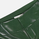 Close-up of the waistband and upper section of the Olivia Vegan Leather Fit Flare Pant in shiny, dark olive by ALICE + OLIVIA, featuring a visible brand label inside.