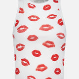 The ALICE + OLIVIA Allen Printed Lips Tank Top is a white sleeveless crop top featuring a playful red lips print, adding a flirty touch to any casual outfit.