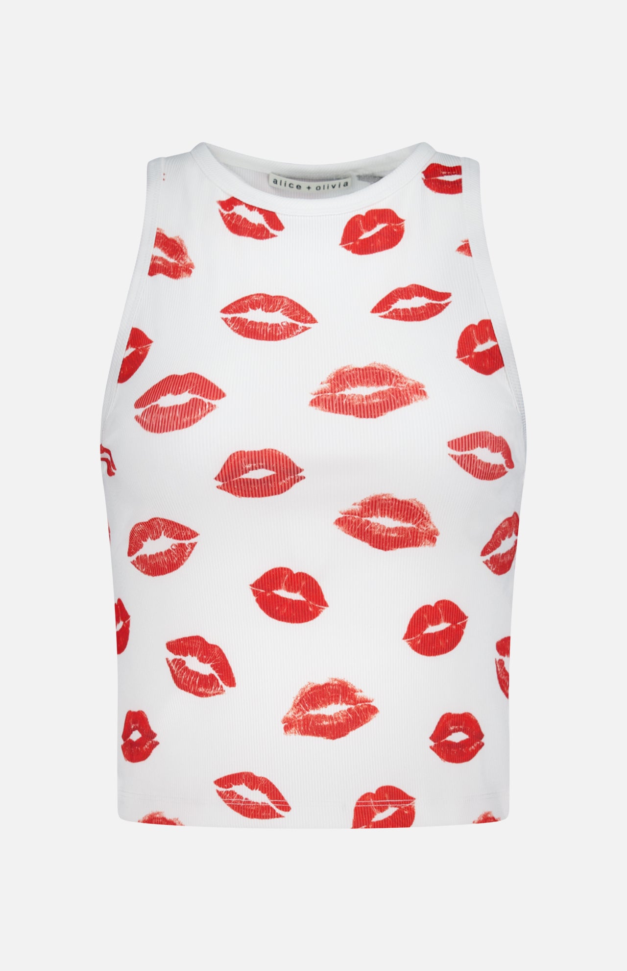 The ALICE + OLIVIA Allen Printed Lips Tank Top is a white sleeveless crop top featuring a playful red lips print, adding a flirty touch to any casual outfit.