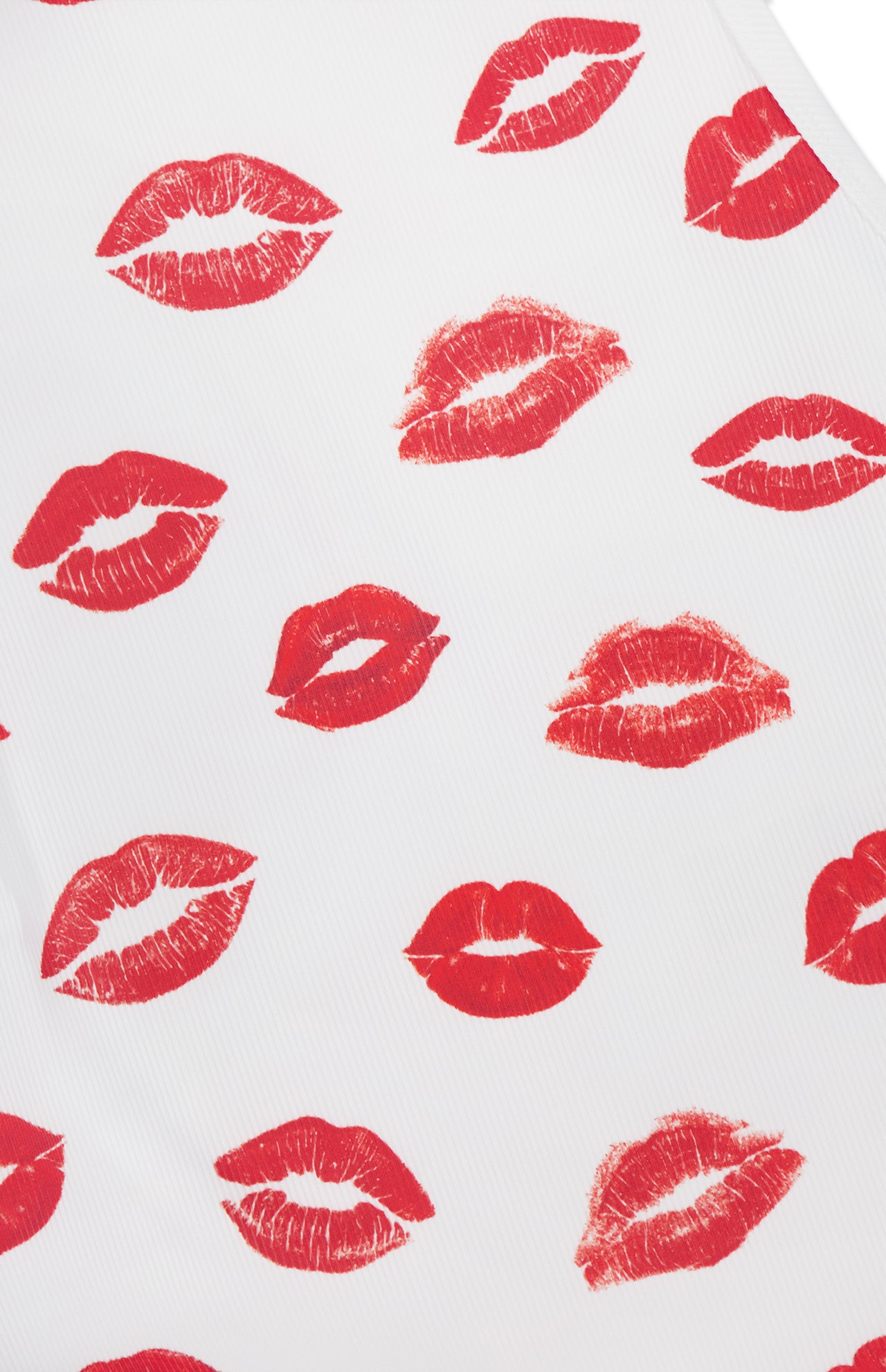 The Allen Printed Lips Tank Top by ALICE + OLIVIA features red lips scattered on a white background, creating a bold graphic look.