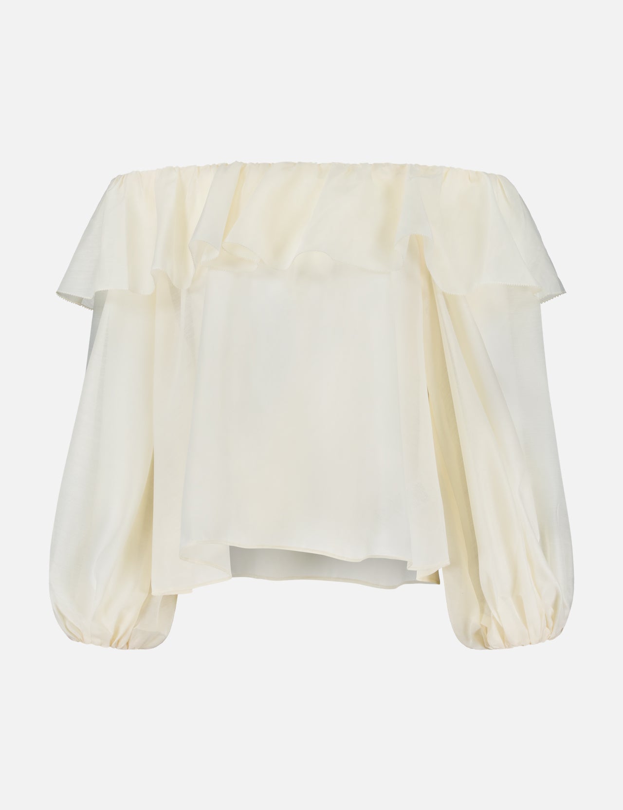 ALICE + OLIVIA’s Alta Off The Shoulder Ruffle Blouse features a cream hue, ruffled neckline detail, billowy long sleeves made of sheer organza, and a loose, flowy silhouette.
