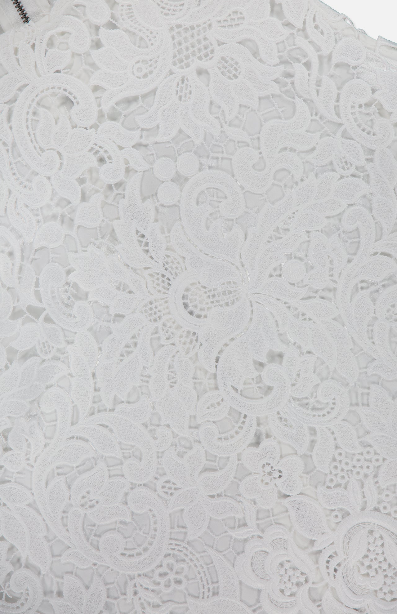 Close-up of the Amal Lace Tank by ALICE + OLIVIA, featuring intricate white lace with floral and leaf patterns, delicate embroidery, textured details, and a sleeveless round neck design.