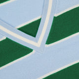 Close-up of ALICE + OLIVIA’s Ayden Cropped V-Neck Pullover Sweater, shown in green, light blue, and white stripes with a double white stripe border at the neckline. A partial brand label is visible—ideal for layering.