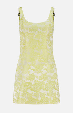 The Charlotte Scoop Neck Mini Dress by ALICE + OLIVIA is a butter yellow metallic floral jacquard mini dress with a scoop neckline, subtle seam detailing, and adjustable straps featuring metallic buckles for a custom fit.